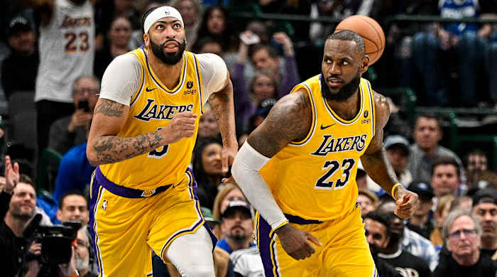 Lakers forwards Anthony Davis, left, and LeBron James run down the court